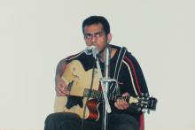 A participant performs during a music competition, Saarang 2005