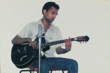 A music participant plays the guitar, Saarang 2005