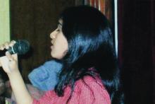 A student singing at a music competition at Saarang