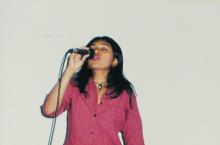 A student singing at a music competition at Saarang