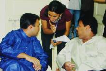 A student volunteer communicates with the judges at a competition at Saarang