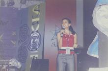 An emcee or judge addressing the audience at Saarang