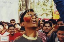 A participant attempts to bite an apple, 2003