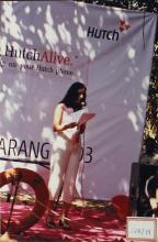 A girl reads out an announcement, 2003