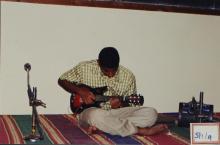 A performer plays the mandolin, 2003