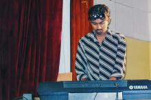 A music competition participant plays the keyboard, Saarang 2005