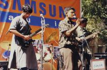 A group performs at an event, 2003