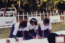 School children take part in an event, 2003