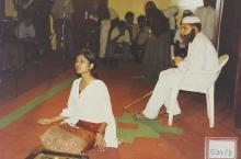 Performers stage a play, 2003
