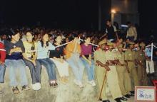 Policemen standing near the audience barricades at Saarang, 2003