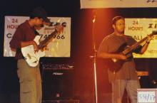 A bassist and a guitarist perform at Saarang, 2003