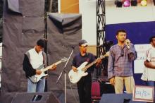A group of musicians performs at an event, 2003