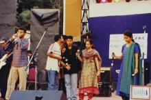 A group of students stage a performance, 2003