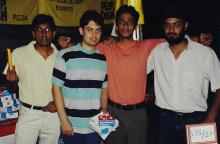Students holding Domino's Pizza boxes at the food court, Saarang 2003