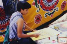 A student participating in an art competition at IITM
