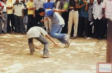 Two students participating in what appears to be a kabbadi game at Saarang 2003