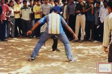 Two students participating in what appears to be a kabbadi game at Saarang 2003