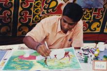 A student participating in an art competition at Saarang 2003