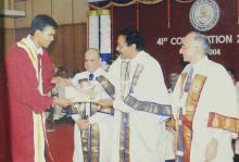 A student receives a degree at the 41st convocation, 2004