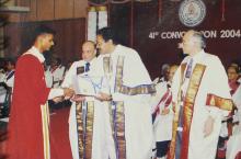 A student receives a degree at the 41st convocation, 2004