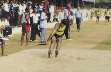 A participant lands after a high jump at the 12th Inter-IIT Staff Sports Meet, 2004