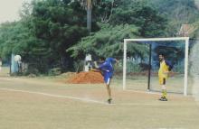 A person kicks the ball during a football match at the 12th Inter-IIT Staff Sports Meet, 2004