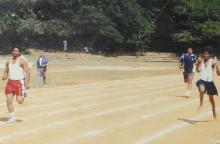 People participate in a relay race at the 12th Inter-IIT Staff Sports Meet, 2004