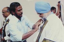Mr. Montek Singh Ahluwalia is assisted with his convocation robes at the 42nd Convocation, 2005