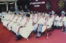 Faculty members seated on the stage at the 42nd Convocation, 2005