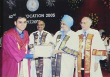 A student receives a degree from Mr. Montek Singh Ahluwalia at the 42nd Convocation, 2005