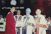 A student receives a degree from Mr. Montek Singh Ahluwalia at the 42nd Convocation, 2005