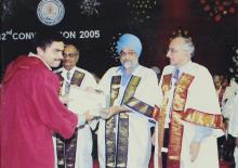 A student receives a degree during the 42nd Convocation, 2005