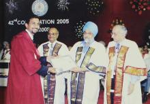 A student poses for a photograph at the 42nd Convocation, 2005