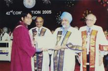 A graduate poses for a photograph at the 42nd Convocation, 2005