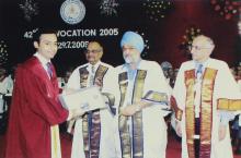 A graduand receives a degree at the 42nd Convocation, 2005