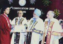 A student is presented a degree certificate at the 42nd Convocation, 2005