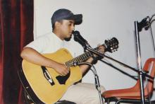 A student performs a solo musical number at a Saarang 2000 event