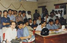 An event that appears to be a debate or shipwreck takes place in a classroom at Saarang 2000