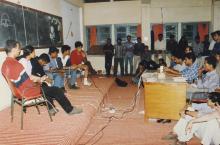 An event that appears to be a debate or shipwreck takes place in a classroom at Saarang 2000