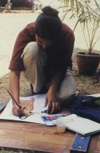 A student participating in the art competition at Saarang 2000 is seen working on an art piece