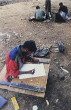 Students participating in an art competition at Saarang 2000 are seen working on art pieces