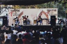 A group of students performing at an outdoor music event at the Saarang 2000 cultural festival
