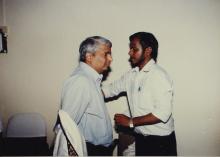 Dr. Gururaj Deshpande is assisted with his convocation robe, Special Convocation (2001)
