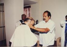 Dr. Krishnaswamy Kasturirangan is assisted with his convocation robes at the 38th Convocation, 2001
