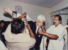 Mr. Azim Premji is assisted with his convocation robes, 38th Convocation (2001)