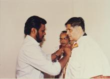 Prof. R. Natarajan being assisted with his convocation robes, 38th Convocation (2001)