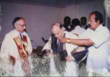 Dr. Krishnaswamy Kasturirangan is assisted with his convocation robes at the 39th Convocation, 2002