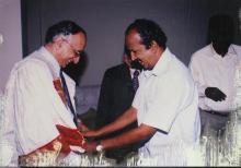 Prof. M. S. Ananth is assisted with his convocation robes at the 39th Convocation, 2002