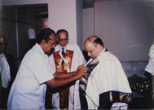 Dr. Krishnaswamy Kasturirangan is assisted with his convocation robes at the 39th Convocation, 2002