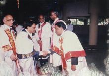 Dr. K. Anji Reddy shakes hands with a faculty member at the 39th Convocation, 2002